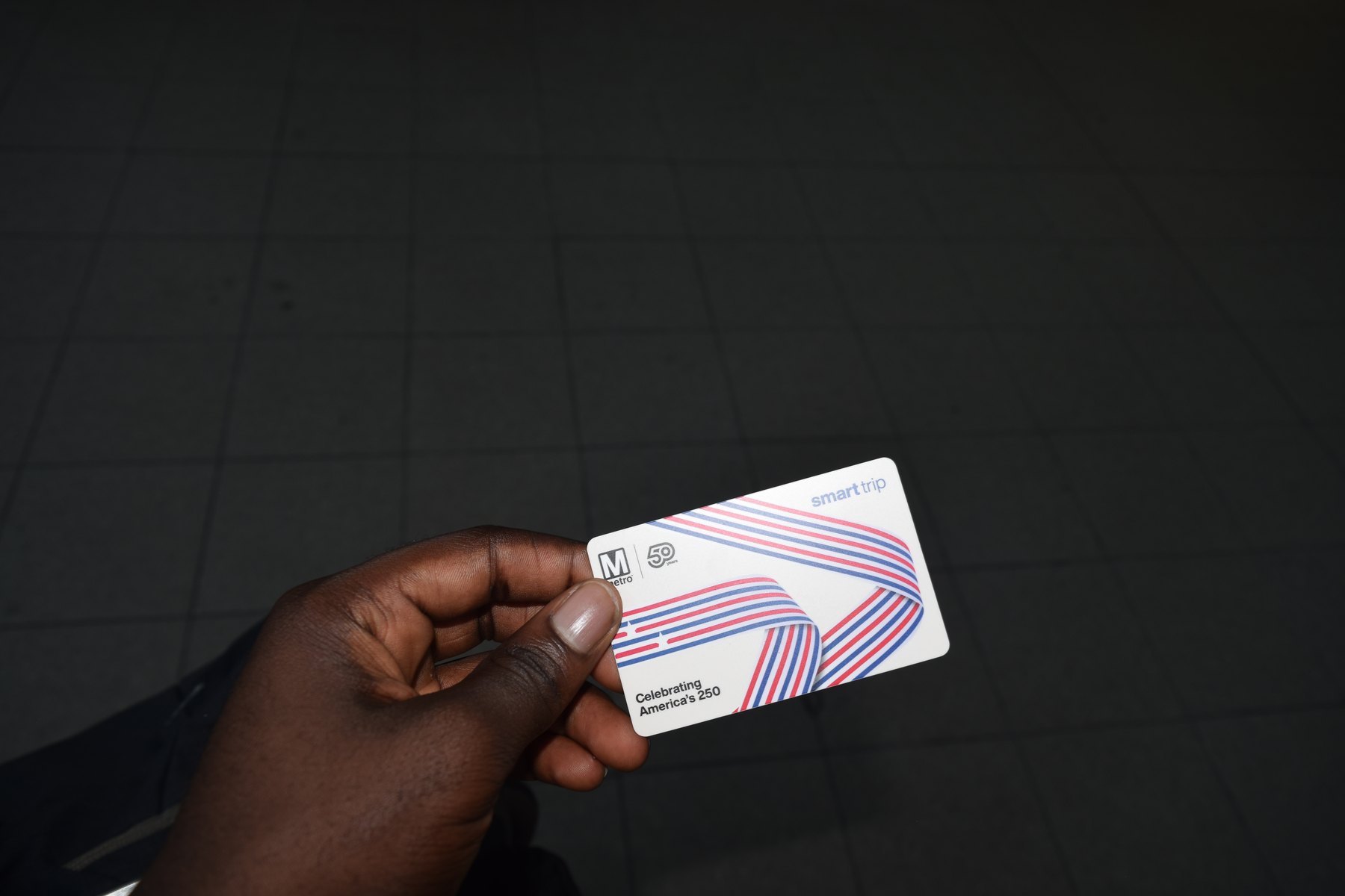 Washington DC SmarTrip metro card held in hand